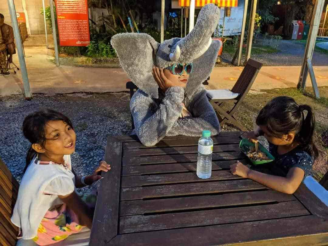 Phare Circus Rising - pre-show entertainment puts smiles on faces - clown in elephant costume with kids